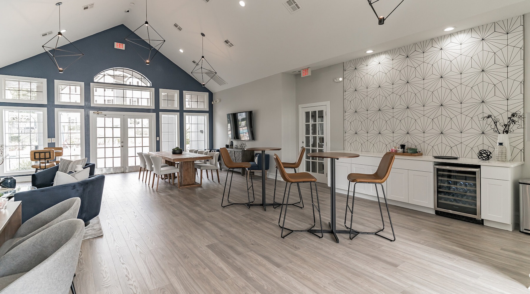 Spacious lounge with bar seating and large windows 